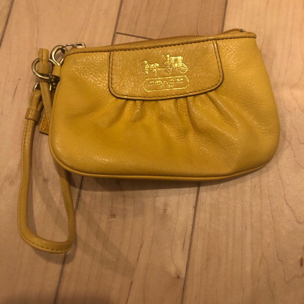 Coach mustard color wristlet